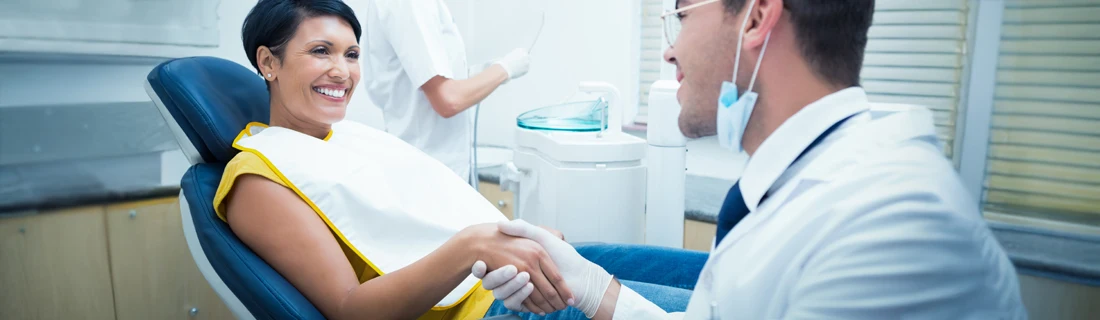 Dentist San Francisco CA Female Patient Shakes Hands with Her Dentist Dental Checkup Focused Female Patient Shakes Hands with Her Dentist Dental Checkup Focused