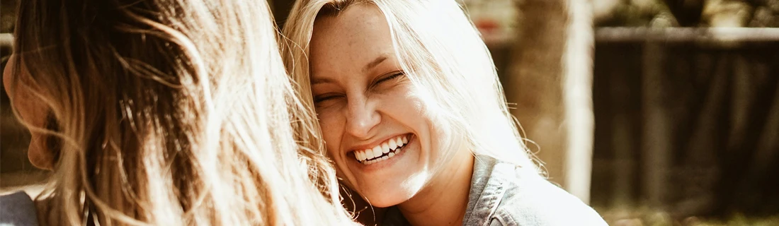 Dentist-San-Francisco-CA-Wide-Shot-of-a-Woman-with-Blonde-Hair-Laughing-with-Her-Friend-Dental-Bridges-Focused.webp Dentist-San-Francisco-CA-Wide-Shot-of-a-Woman-with-Blonde-Hair-Laughing-with-Her-Friend-Dental-Bridges-Focused.webp